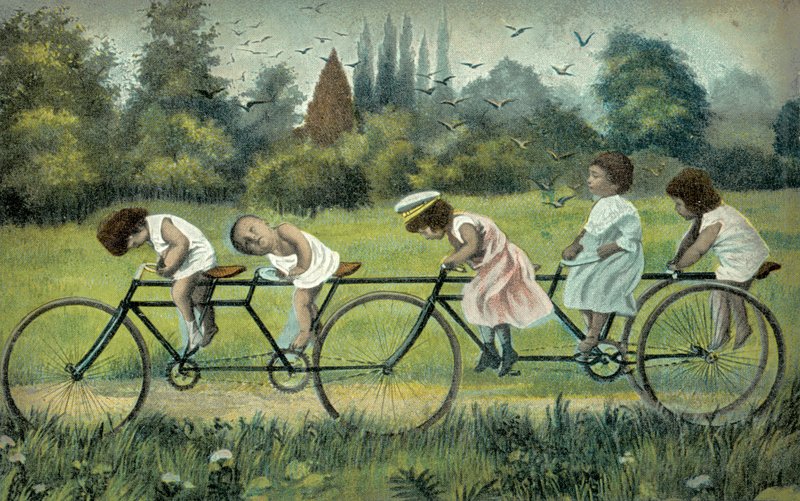 Children on a four-wheeled bicycle by English Photographer