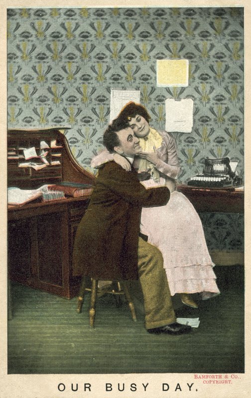 Couple embracing in an office by English Photographer