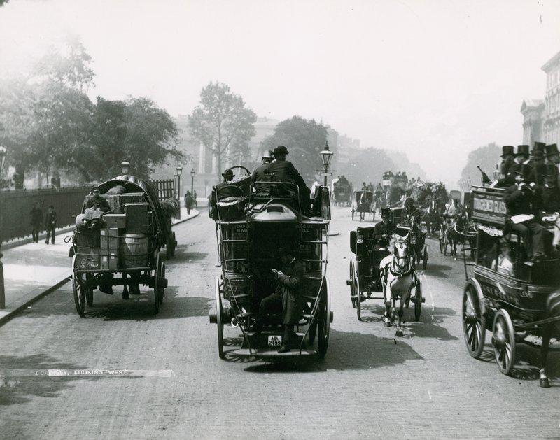 Horse-Drawn Traffic on a Busy Road by English Photographer