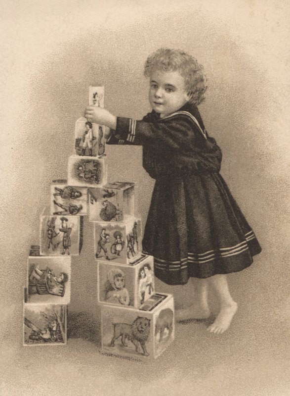 Child stacking building blocks by English School