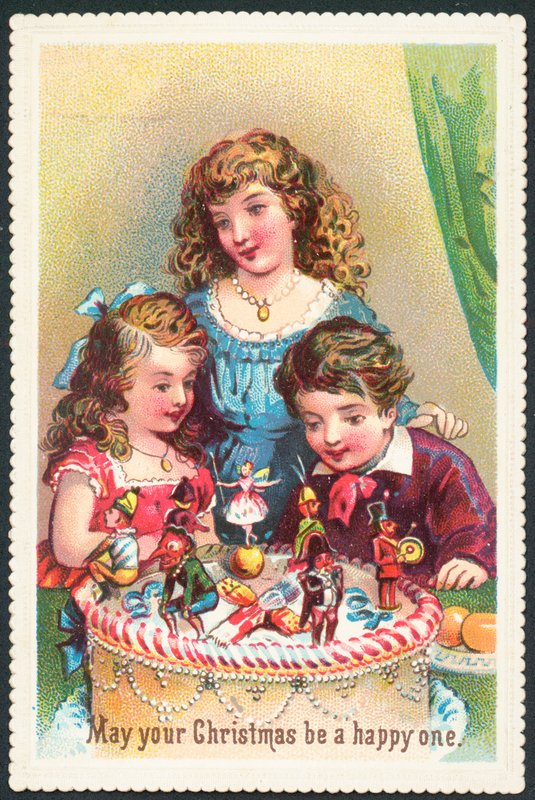 Children looking at Christmas Cake by English School