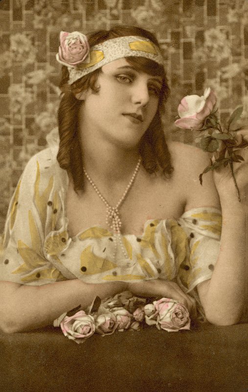 Woman Posing with Flowers by European Photographer