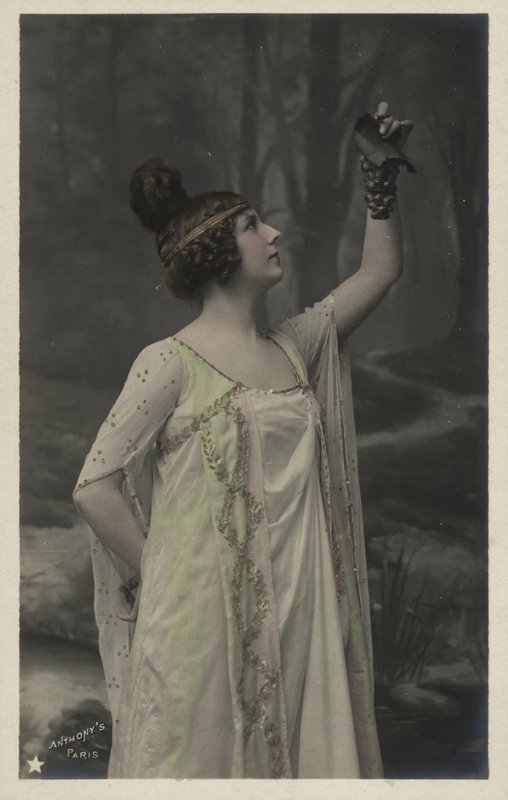 Woman with bunch of grapes by French Photographer